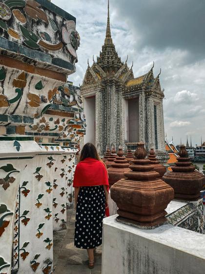 standing on the steps of Wat Arun