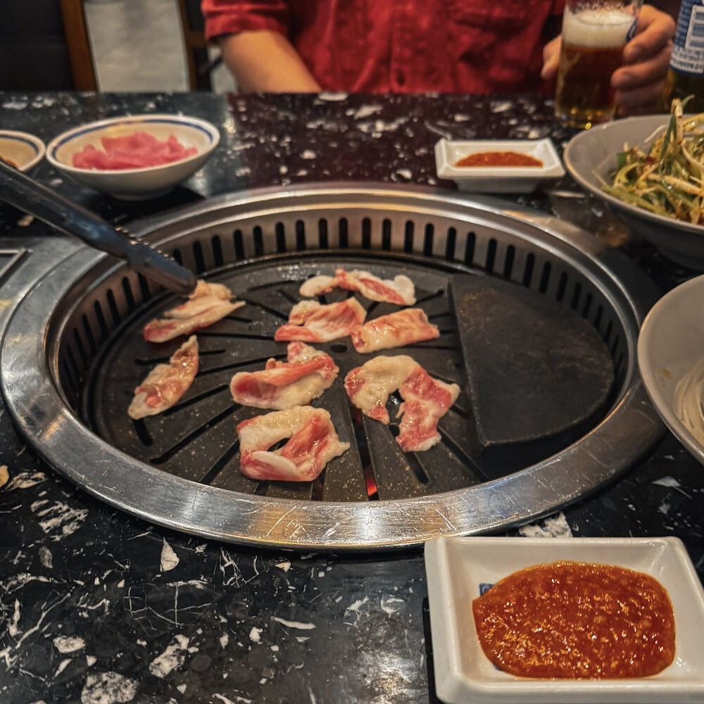 grilling meat at a KBBQ in Seoul