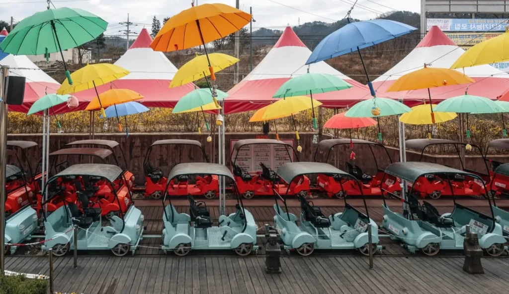rail bikes under colourful umbrellas
