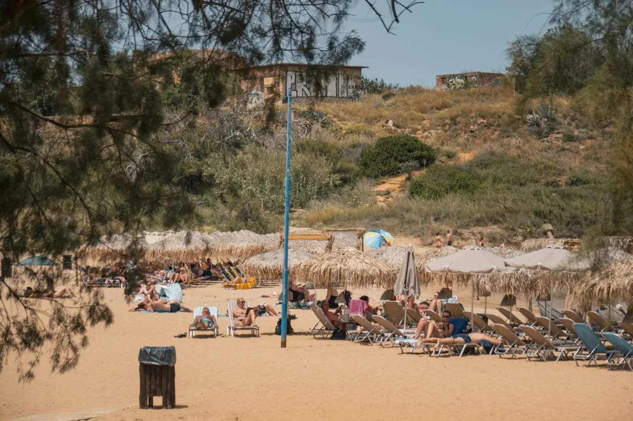 people lounging on sunbeds yannis beach crete