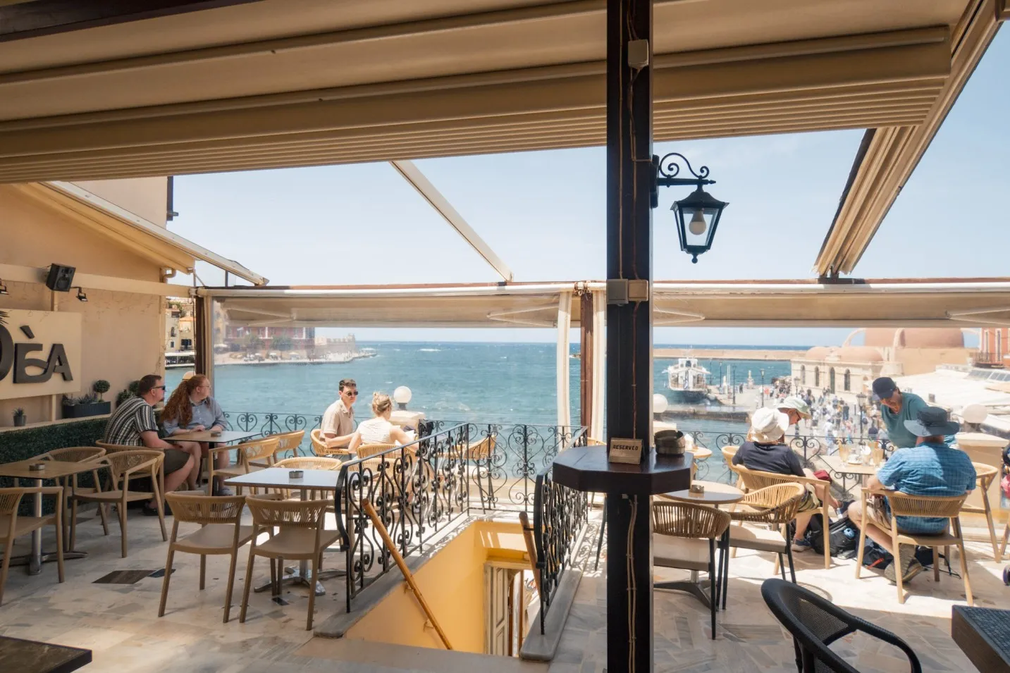 View of Chania's harbour and lighthouse from Oea cafe terrace