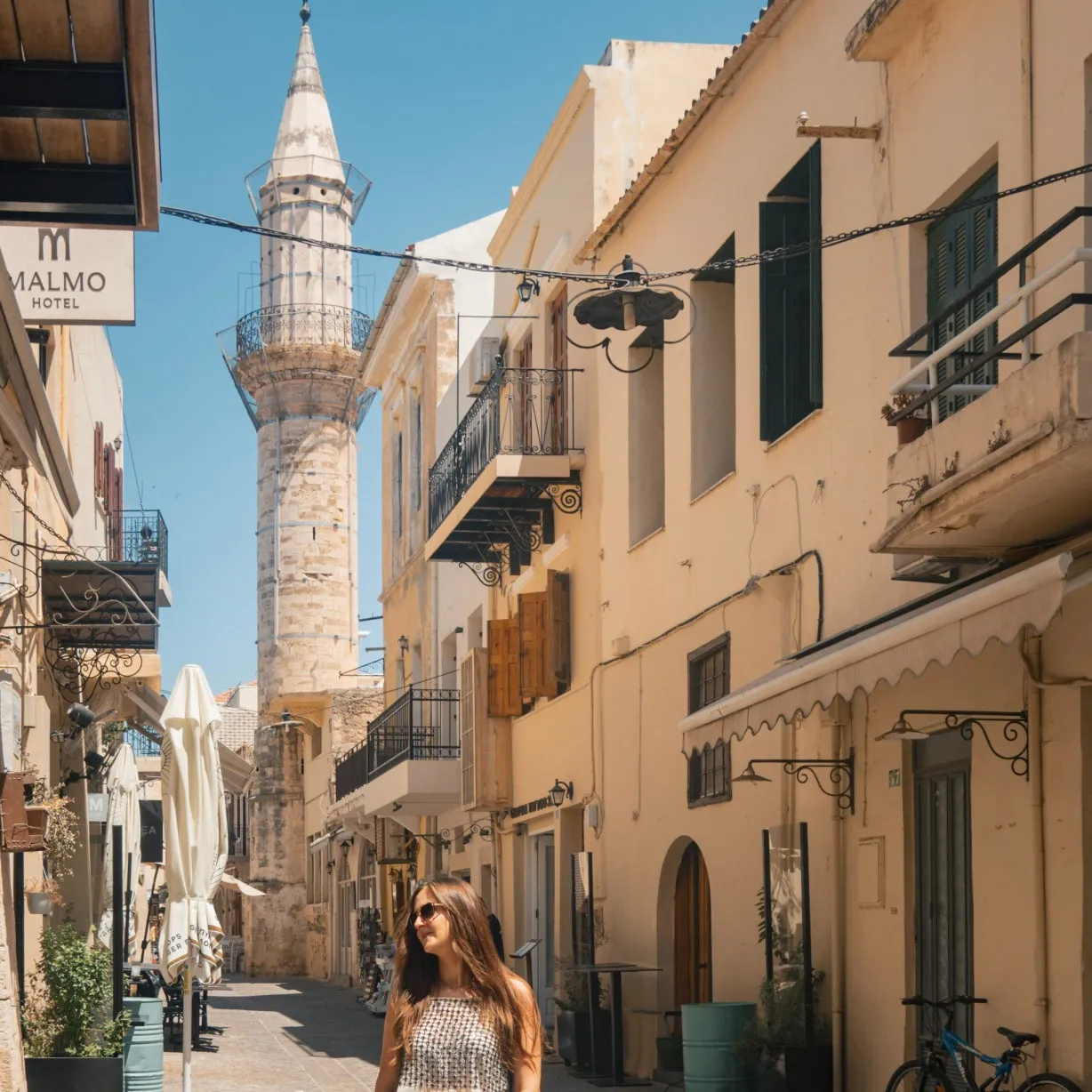 tara o'reilly standing in front of minaret in Splantzia