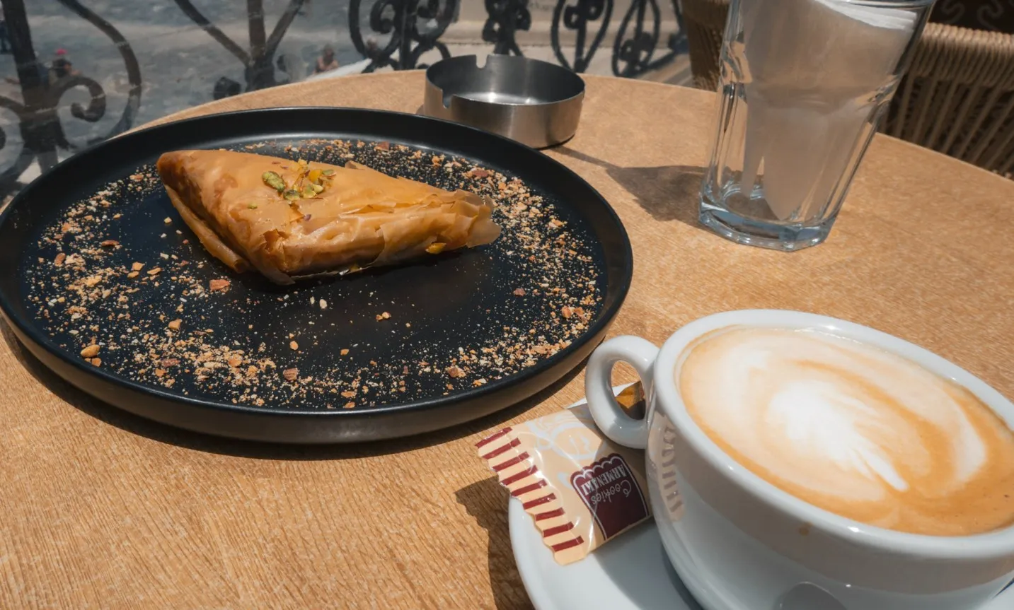 cappuccino and a piece of baklava from oea rooftop cafe chania 
