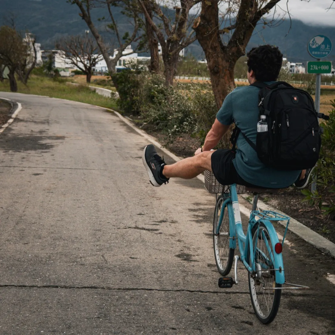 man cycling bike kicking legs in air dapo pond